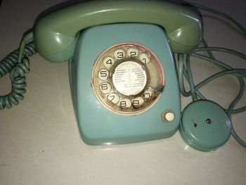 High angle view of telephone booth on table