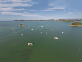 High angle view of boats sailing in sea against sky