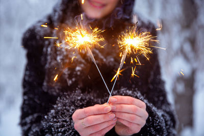 Person holding firework display