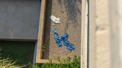 Clothes drying against blue wall