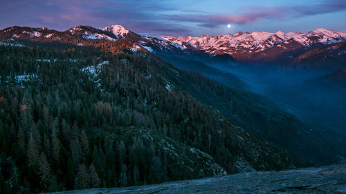 Scenic view of snowy landscape against sky at night