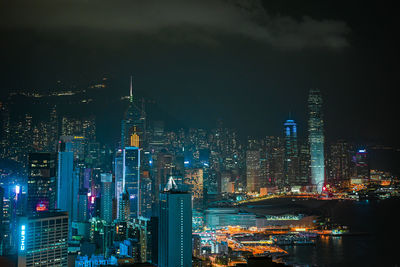 Aerial view of illuminated buildings in city at night