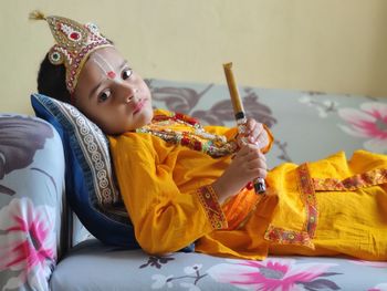 Portrait of  boy playing shree krishna janamdin 