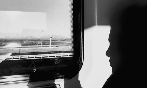 Close-up of airplane window in train