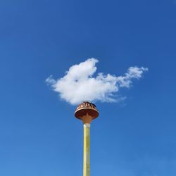Low angle view of street light against blue sky