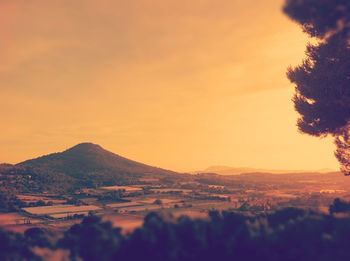 Scenic view of mountains against sky at sunset