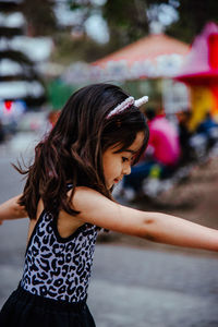 Close-up of girl looking away outdoors