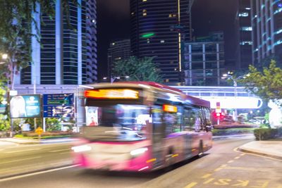 Blurred motion of cars on road in city at night