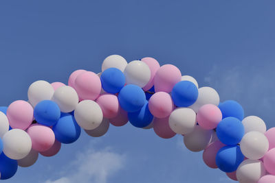 Image of some colorful balloons on the blue sky background.