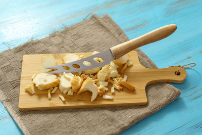 Close-up of knife on cutting board