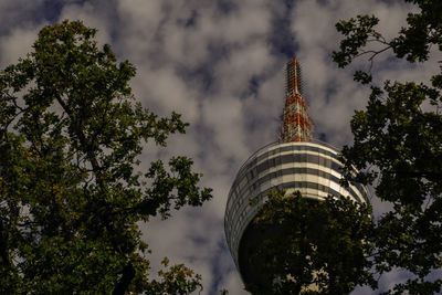 Low angle view of building against cloudy sky