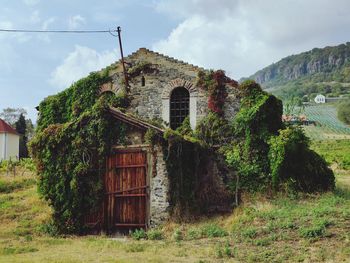 House on field against sky