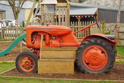 Red tractor in bus