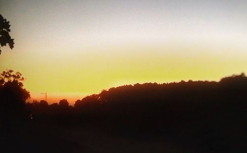 Scenic view of silhouette landscape against sky during sunset