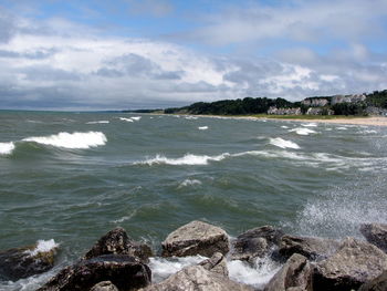 Scenic view of beach and sea against sky