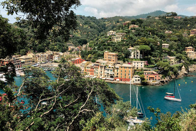 High angle view of townscape by sea