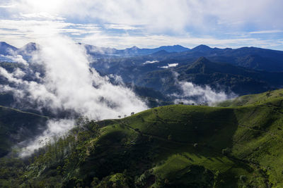 Scenic view of waterfall against sky