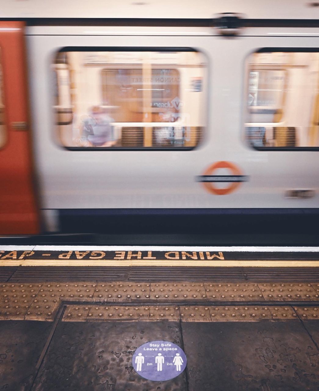 BLURRED MOTION OF TRAIN AT RAILROAD STATION