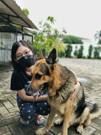 Portrait of woman with dog