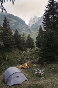 View of tent on mountain against the sky