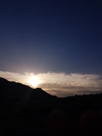 Scenic view of silhouette landscape against sky during sunset