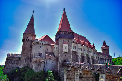 Low angle view of historical building against blue sky