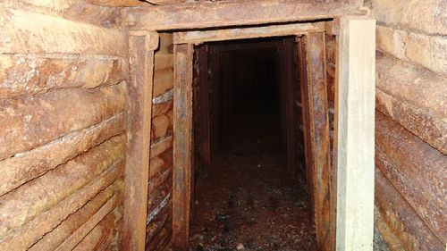 Close-up of open door of abandoned building