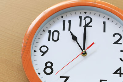 Close-up of clock on table