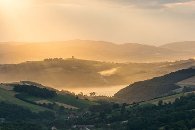 Scenic view of landscape against sky during sunset