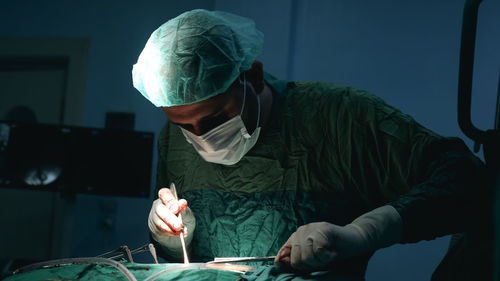 Doctors performing an appendectomy surgery, surgical concept.