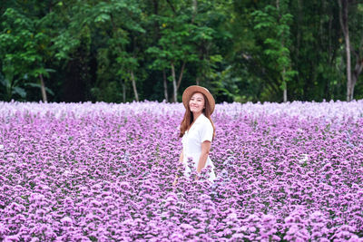 Portrait image of a beautiful young asian woman in margaret flower field