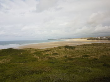 Scenic view of beach and sea against sky