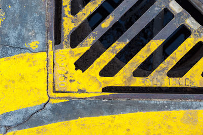 Close-up of yellow arrow sign