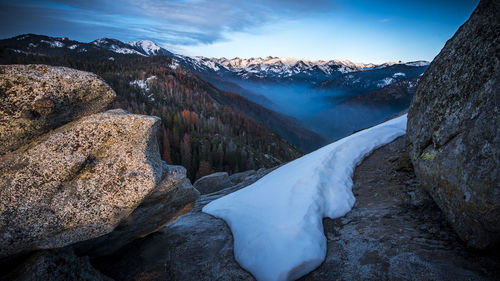 Close-up of snow covered mountain against sky