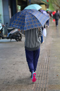 Low section of people walking outdoors