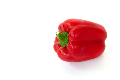 Close-up of red bell pepper against white background