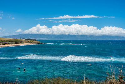 Scenic view of sea against blue sky