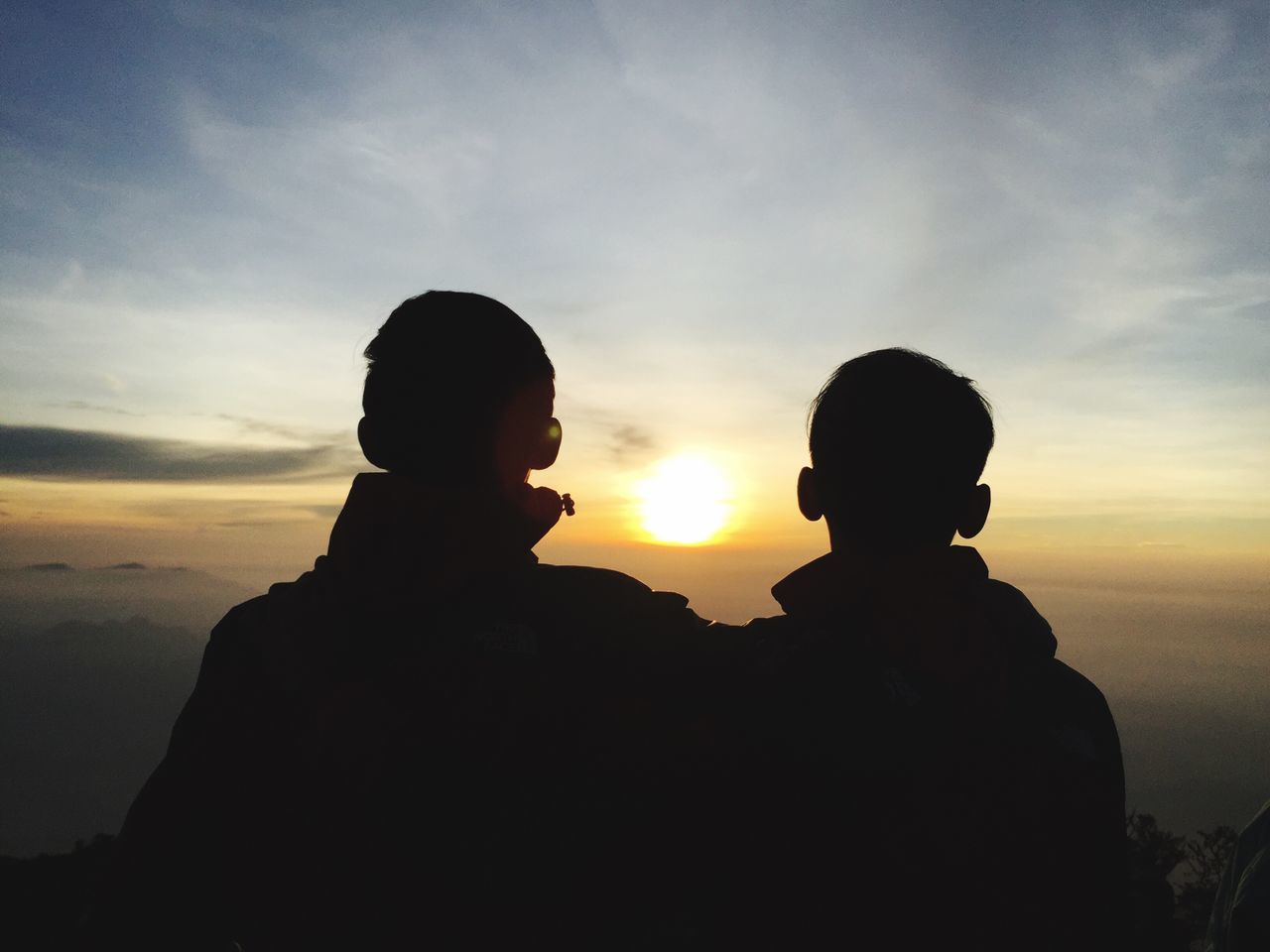 silhouette, sunset, sky, tranquility, beauty in nature, scenics, lifestyles, tranquil scene, leisure activity, rock - object, nature, cloud - sky, idyllic, rock formation, outdoors, sun, cloud, remote, vacations, landscape