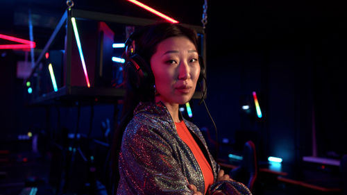 Smiling woman while sitting at internet cafe