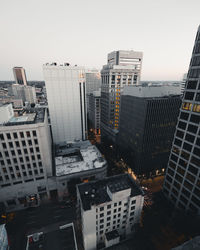 High angle view of buildings in city against clear sky