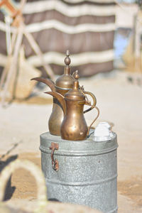 Old-fashioned kettles on container