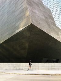 Woman in front of building