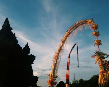 Low angle view of ferris wheel against sky