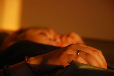 Close-up of woman sleeping at home during morning