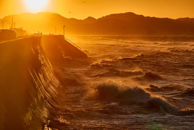 Scenic view of sea against sky during sunrise