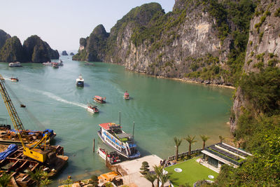 High angle view of boats in sea against sky