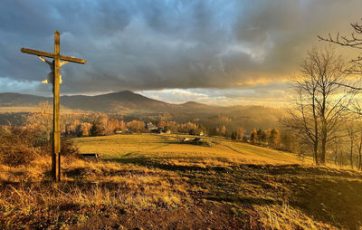 Scenic view of field against sky during sunset