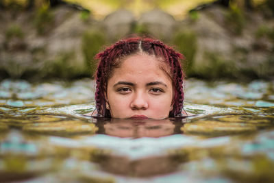 Close-up portrait of a boy in water
