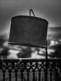 Close-up of metal fence against sky