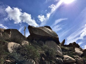 Low angle view of rock formation against sky